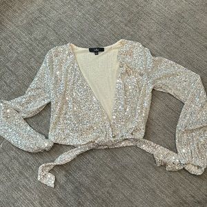 Lulus small sequin cream long sleeve blouse. Button closure.